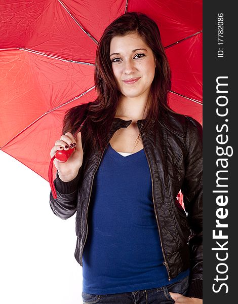 A woman is holding a red umbrella while smiling. A woman is holding a red umbrella while smiling.