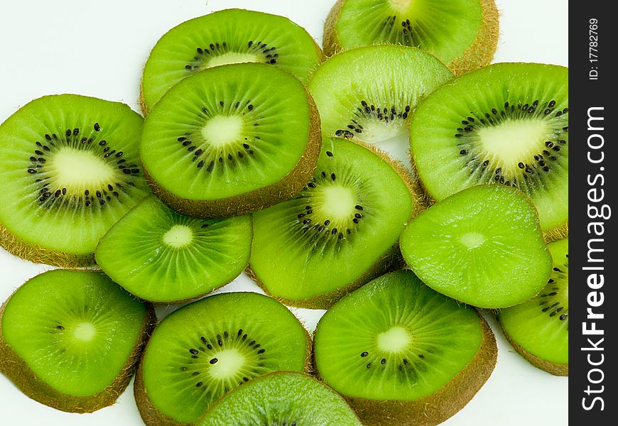 Sliced kiwi fruit on white