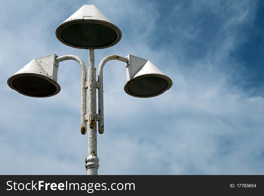 Three Loudspeaker against the blue sky with clouds