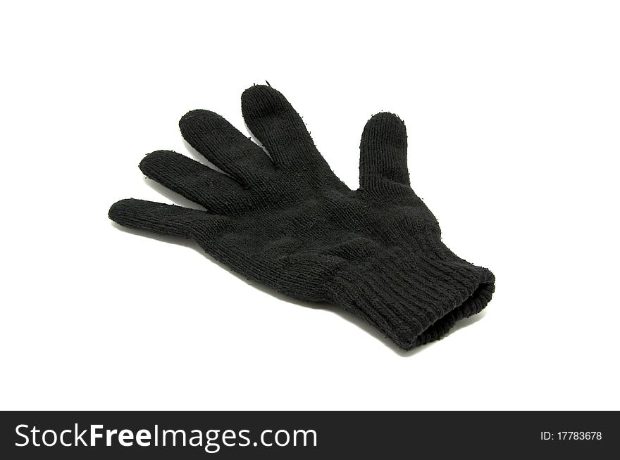 Black winter glove on a white background