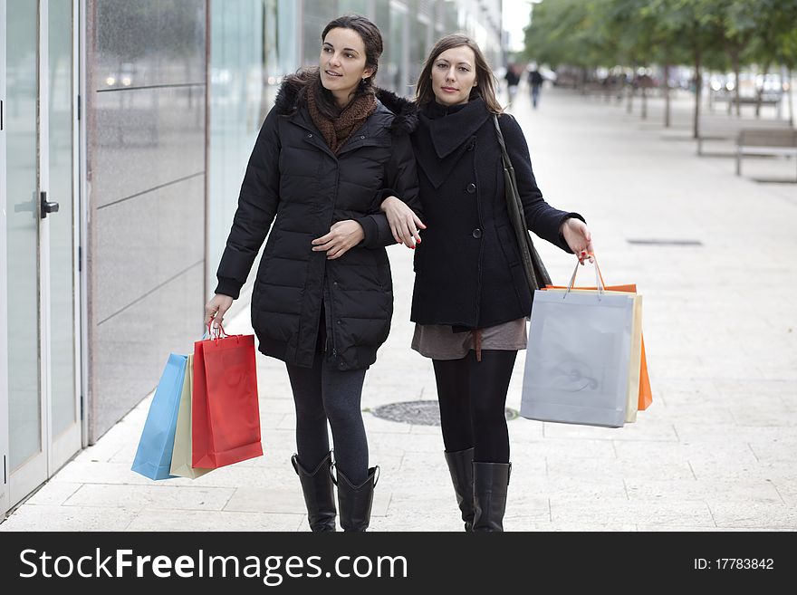 Two women going shopping in the city. Two women going shopping in the city