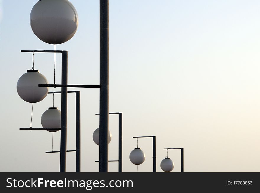 Lanterns round on poles against the sky