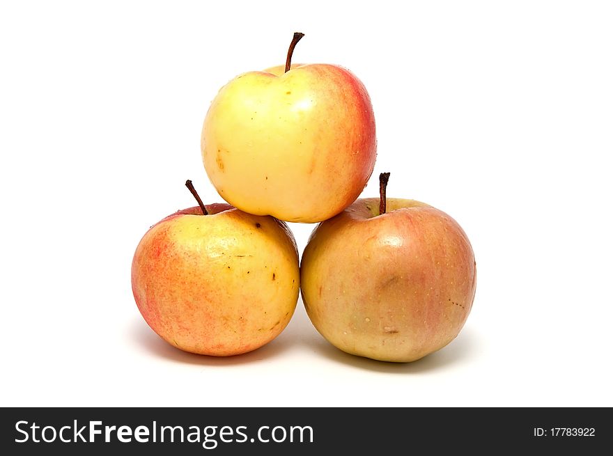 Ripe juicy apples on a white background