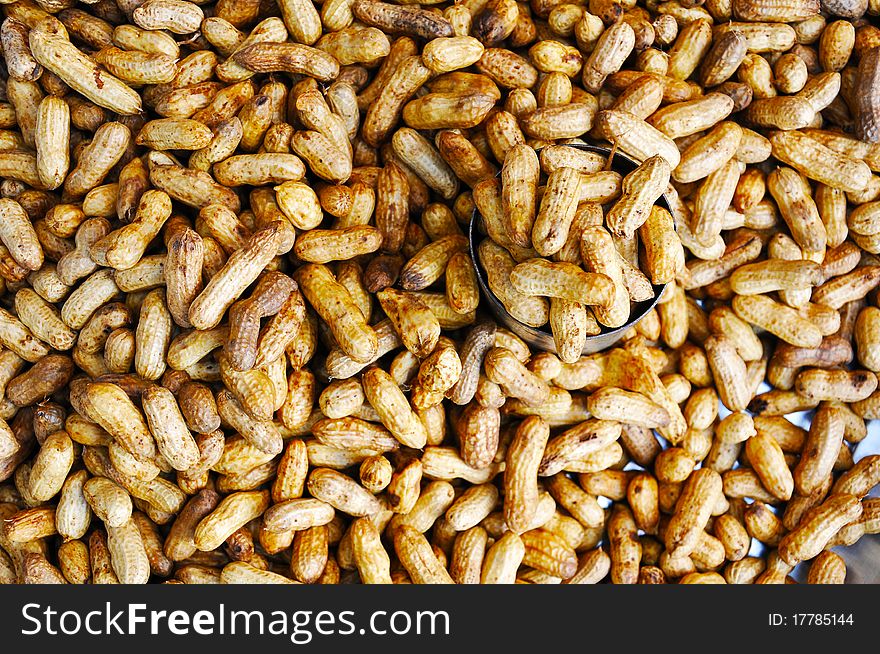 Boiled Peanuts with a cup of peanuts