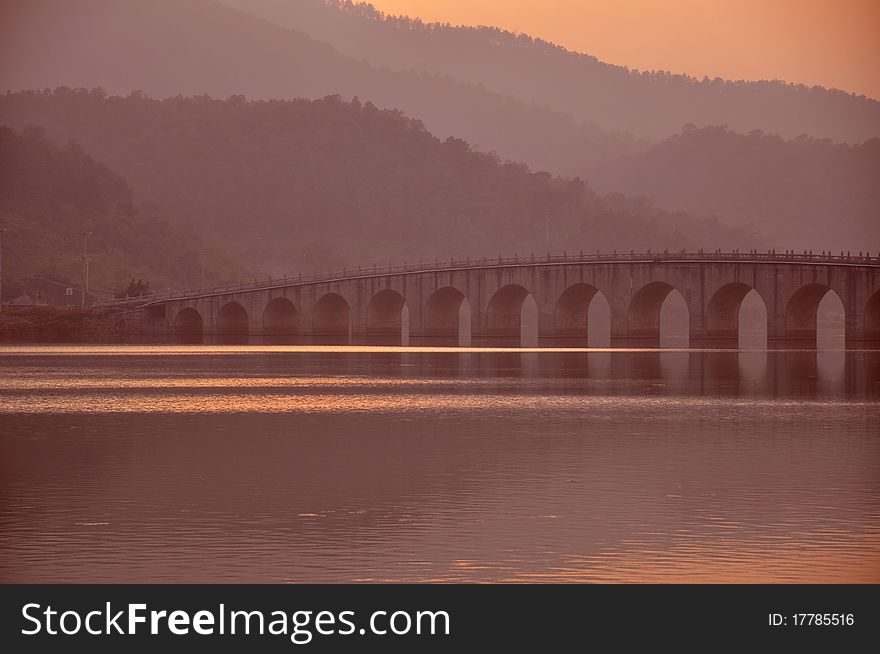 Stone Arch Bridge In  Sunset