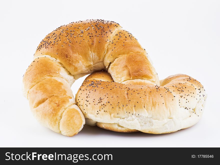 Two croissants with poppy isolated over white