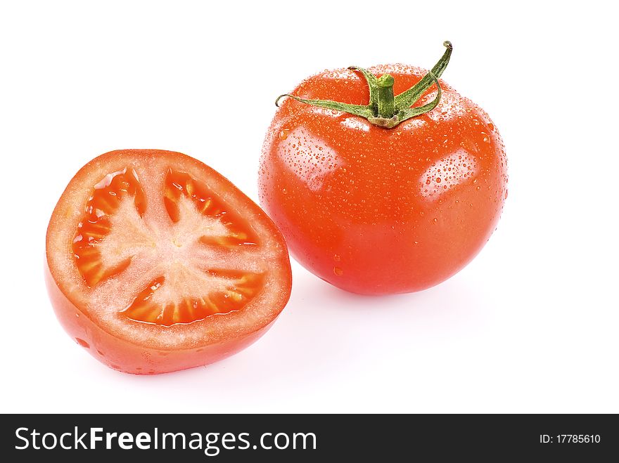 Fresh tomato with one half over white background. Fresh tomato with one half over white background