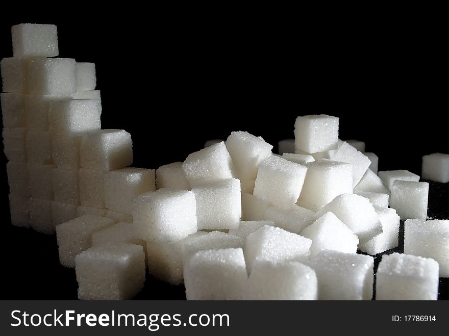 A pile of sugar cubes in a mess. A pile of sugar cubes in a mess