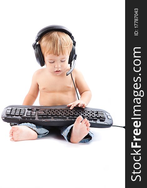 Little boy with headphones and keyboard. Little boy with headphones and keyboard