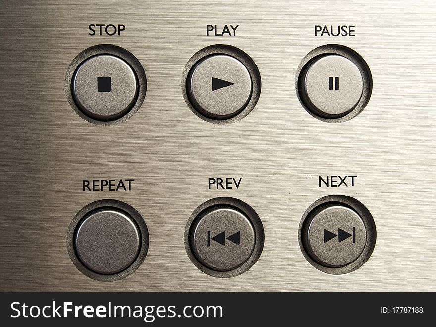 Set of buttons on brushed metal background