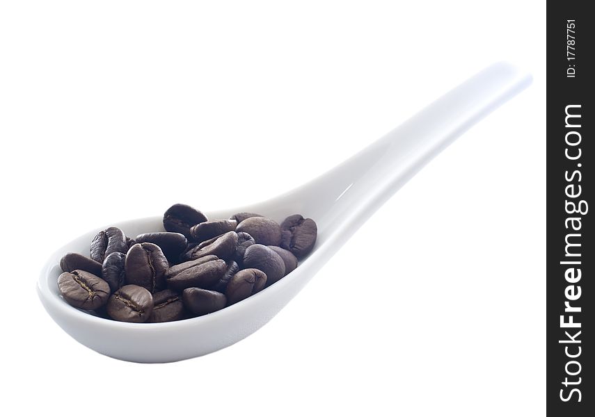Coffee on white ceramic spoon