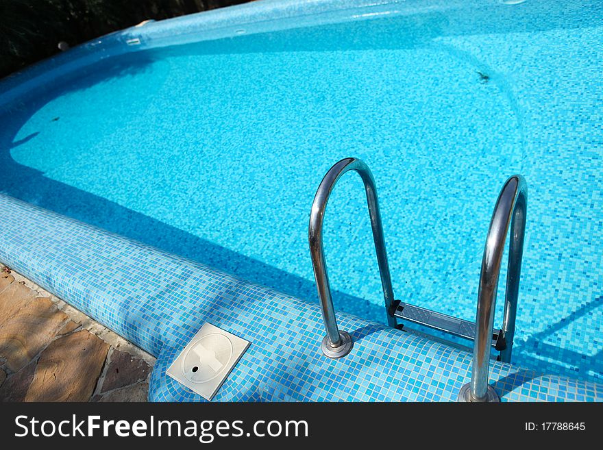 Picture of swimming pool with blue water. Picture of swimming pool with blue water