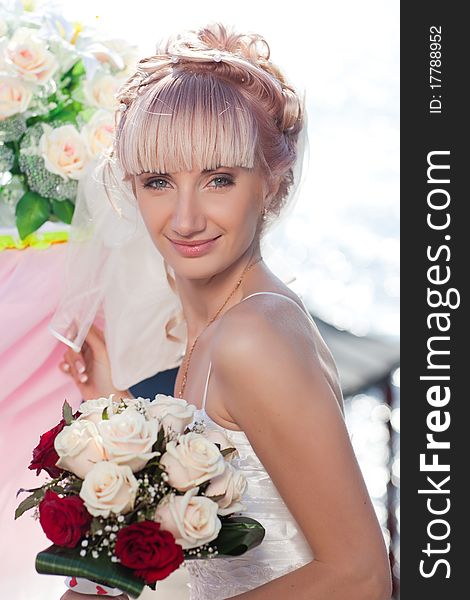 Happy caucasian bride posing with wedding bouquet. Happy caucasian bride posing with wedding bouquet