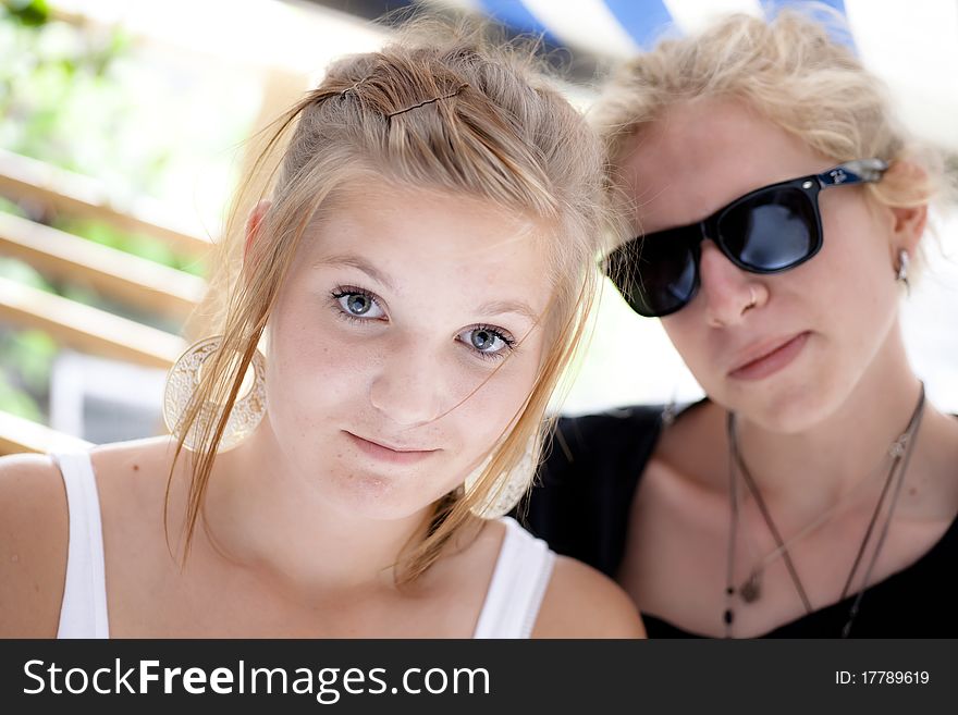 Boy and girl teens looking into camera with a friendly smile. Boy and girl teens looking into camera with a friendly smile