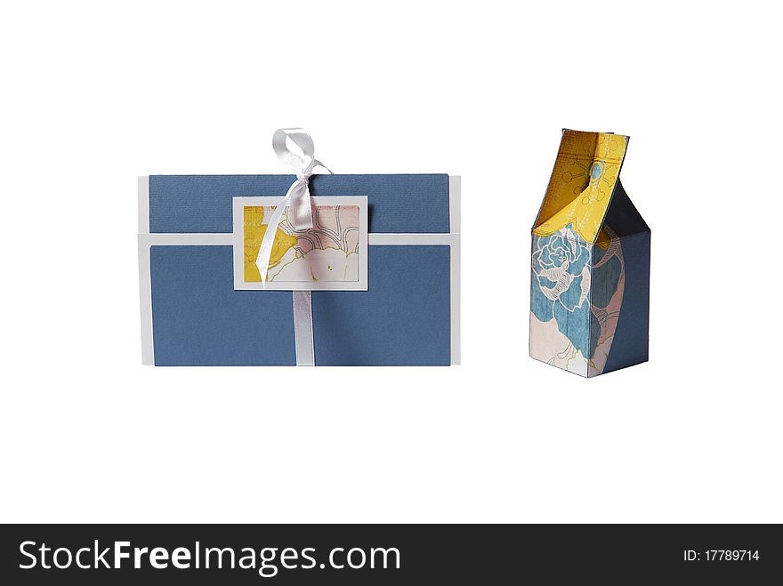 Gift box and invitation on white