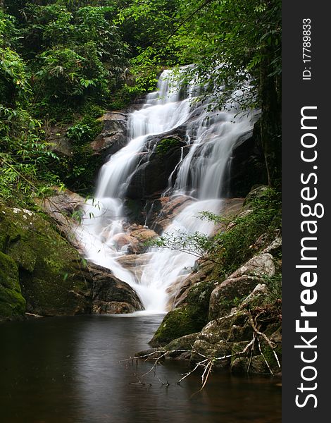 Beautiful Waterfall In Deep Forest.