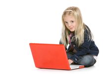 Cute Little Girl Sitting Down With Laptop Royalty Free Stock Photo