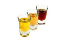 Three Glasses With Several Liquids Stock Photography