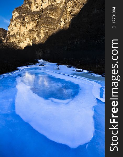 Cold winter landscape of a frozen lake