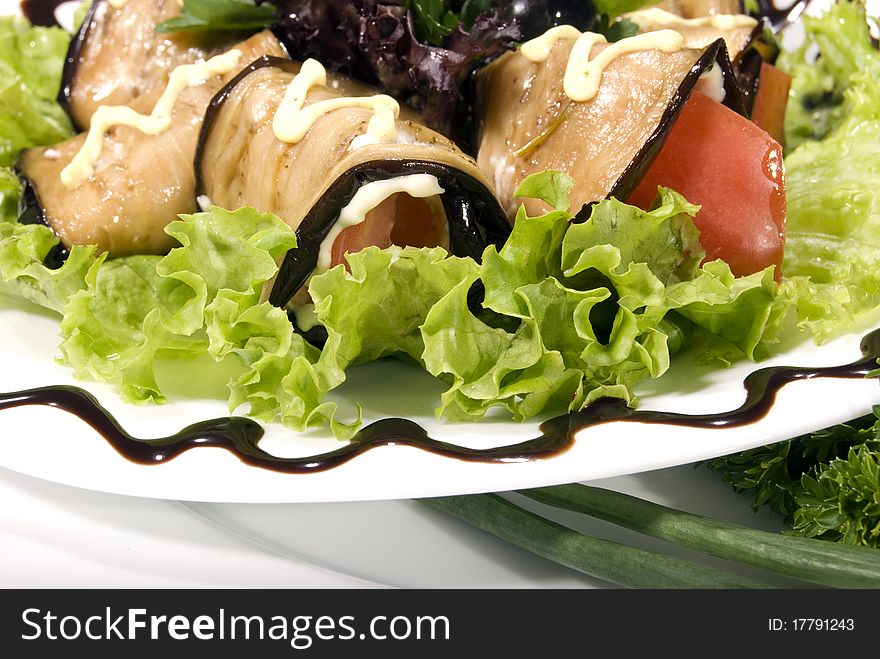 Appetizer made of rolled egg-plants served with salad. Appetizer made of rolled egg-plants served with salad