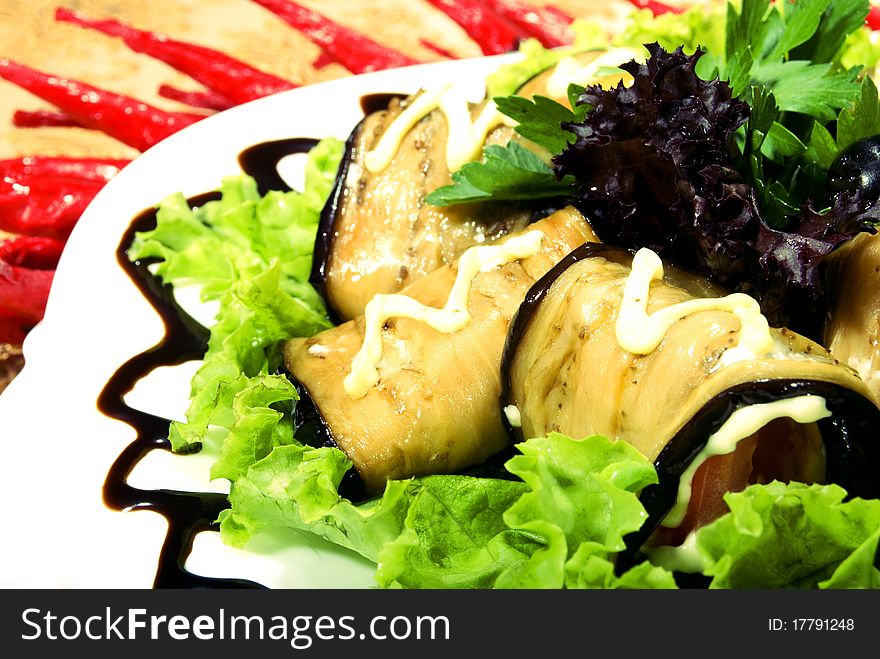 Appetizer made of rolled egg-plants served with salad. Appetizer made of rolled egg-plants served with salad