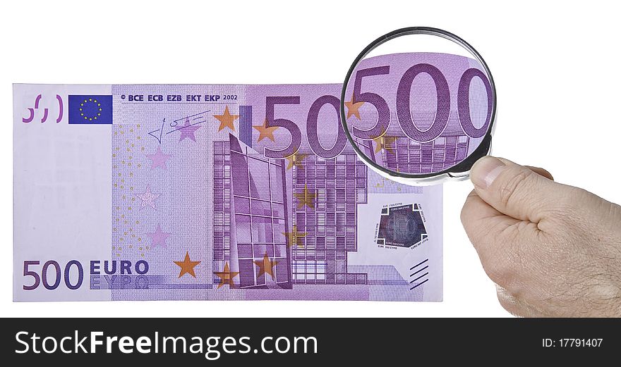 This image shows a bank of 500 euros, seen through a magnifying glass. This image shows a bank of 500 euros, seen through a magnifying glass