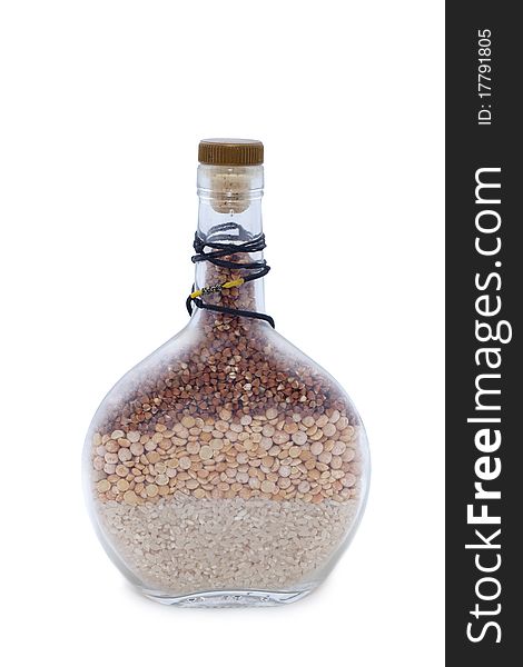 Bottle with rice and groats isolated white