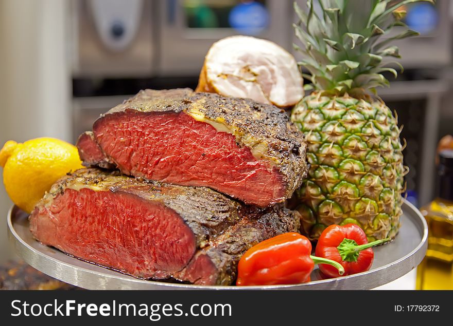 Meat and vegetables in assortment on tray. Meat and vegetables in assortment on tray