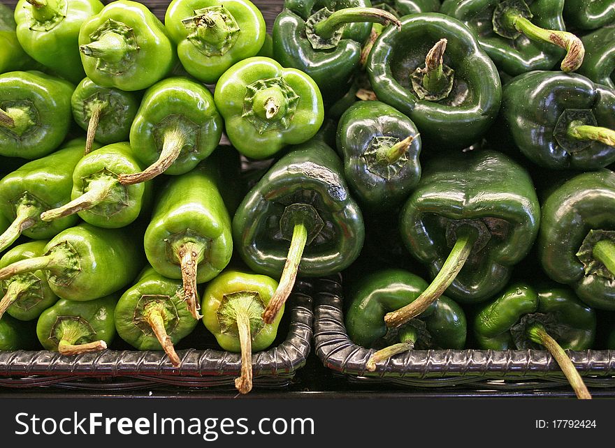 Spicy green peppers piled up at market