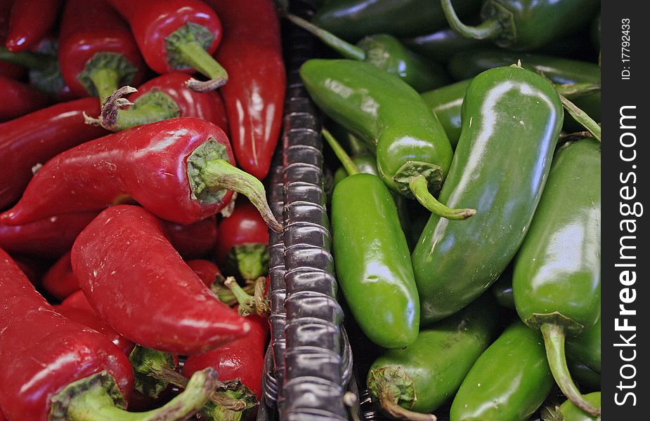 Spicy hot red and green peppers at market. Spicy hot red and green peppers at market