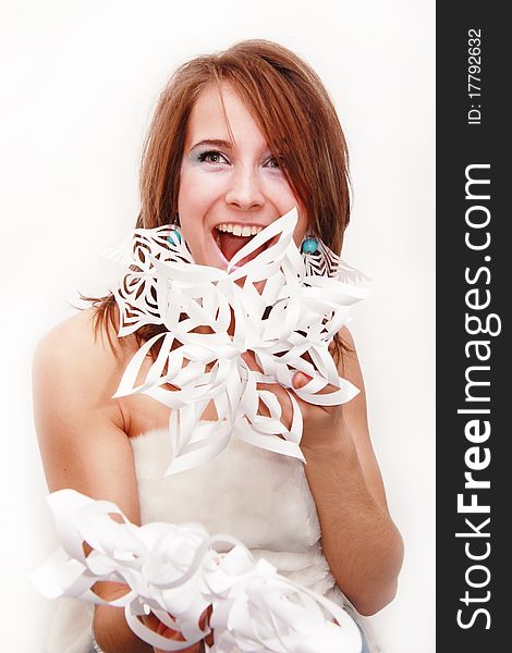 Portrait of young girl with makeup and cut snowflakes isolated on white. Portrait of young girl with makeup and cut snowflakes isolated on white