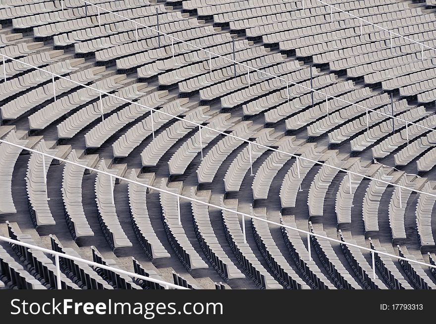 Many empty plastic chair rows on the sport stadium. Many empty plastic chair rows on the sport stadium