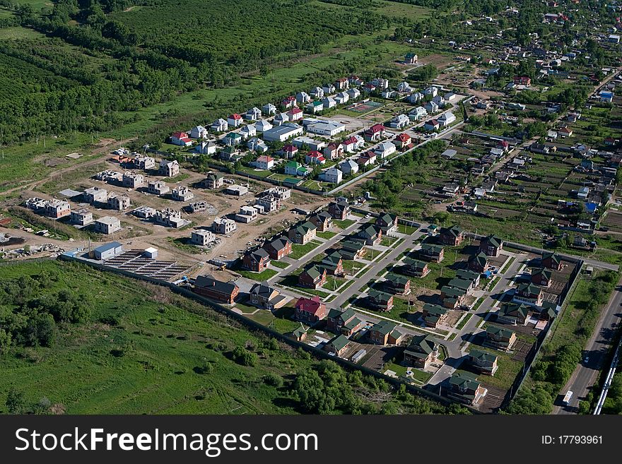 Photo of Town from the helicopter. Cottage settlement - Aerial View. Building of houses. Photo of Town from the helicopter. Cottage settlement - Aerial View. Building of houses