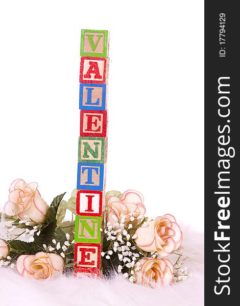 Children`s blocks spelling Valentine and roses. Children`s blocks spelling Valentine and roses