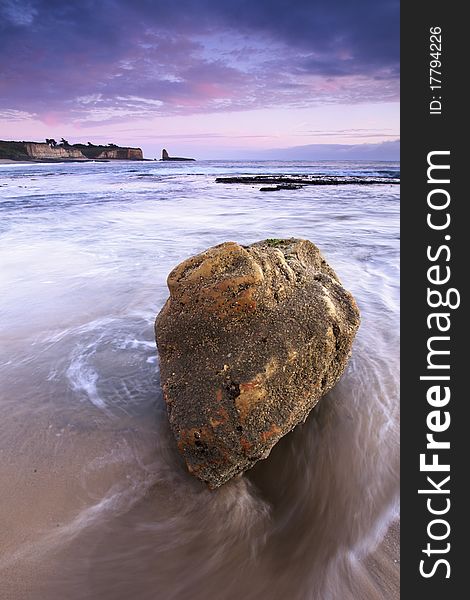 Seascape at the California Coast with a solid rock in the foreground