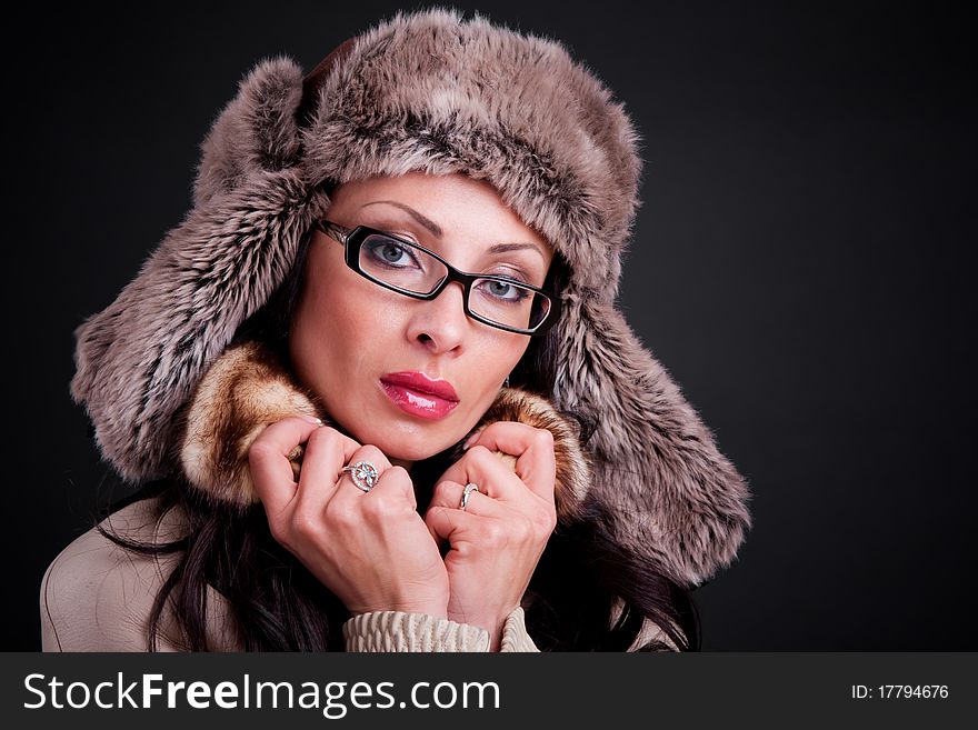 Attractive girl wear in winter fur hat