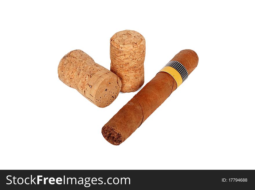 Big cigar and a few wine corks on white background. Big cigar and a few wine corks on white background