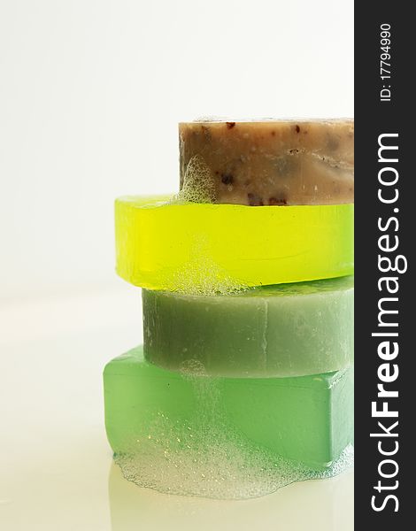A stack of 4 colorful glycerine soaps. A stack of 4 colorful glycerine soaps.
