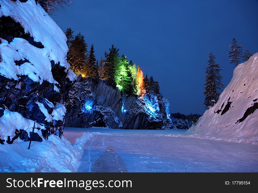Night with color illumination in winter season on Marble Snowy Mountain. Night with color illumination in winter season on Marble Snowy Mountain
