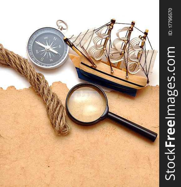 Rope, loupe, compass and model classic boat