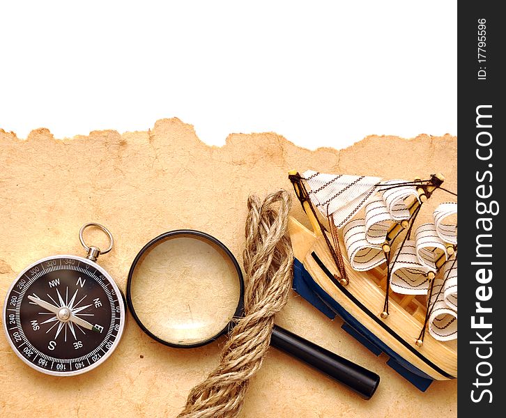 Rope, Loupe, Compass And Model Classic Boat