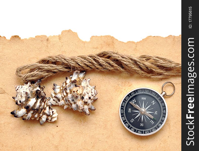 Seashell, compass and rope