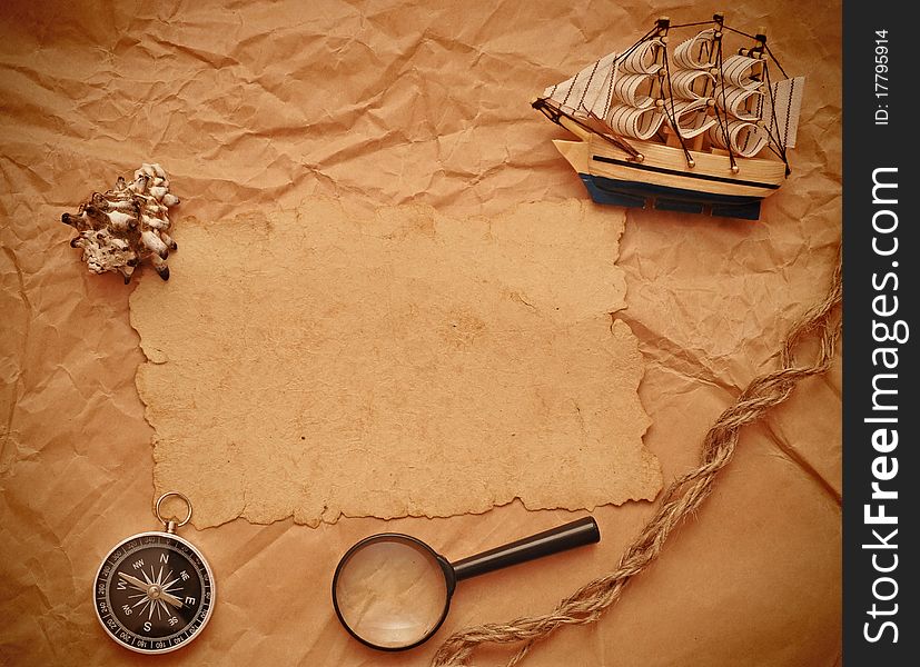 Loupe, rope and model classic boat on grunge background. Loupe, rope and model classic boat on grunge background