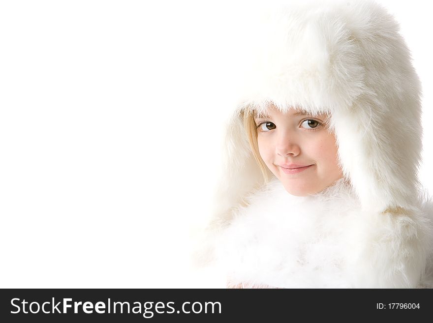 Cute little girl wearing a white fur coat and hat isolated on white background. Cute little girl wearing a white fur coat and hat isolated on white background