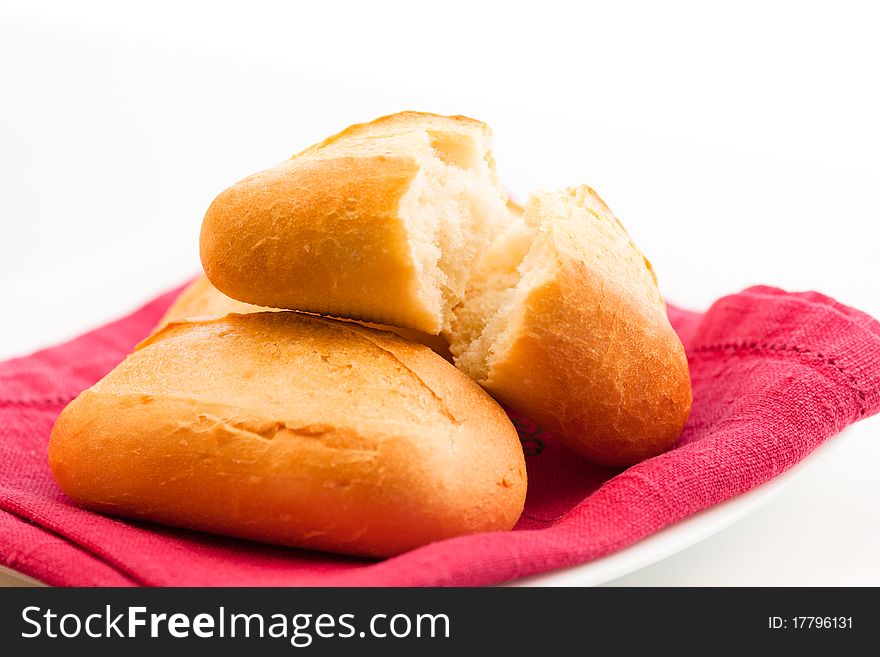 Appetizing soft delicious rolls on a red napkin. Appetizing soft delicious rolls on a red napkin