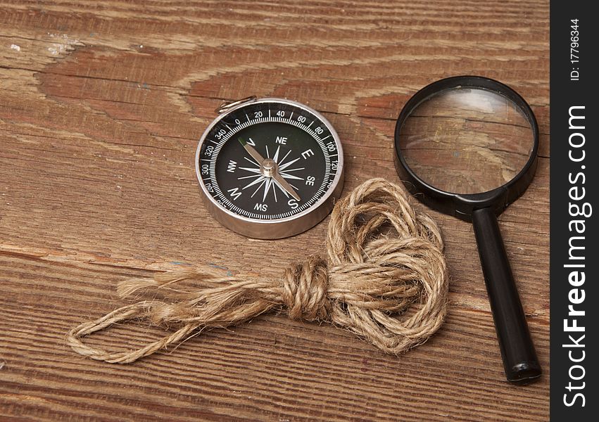 Rope, Compass And Magnifying Glass