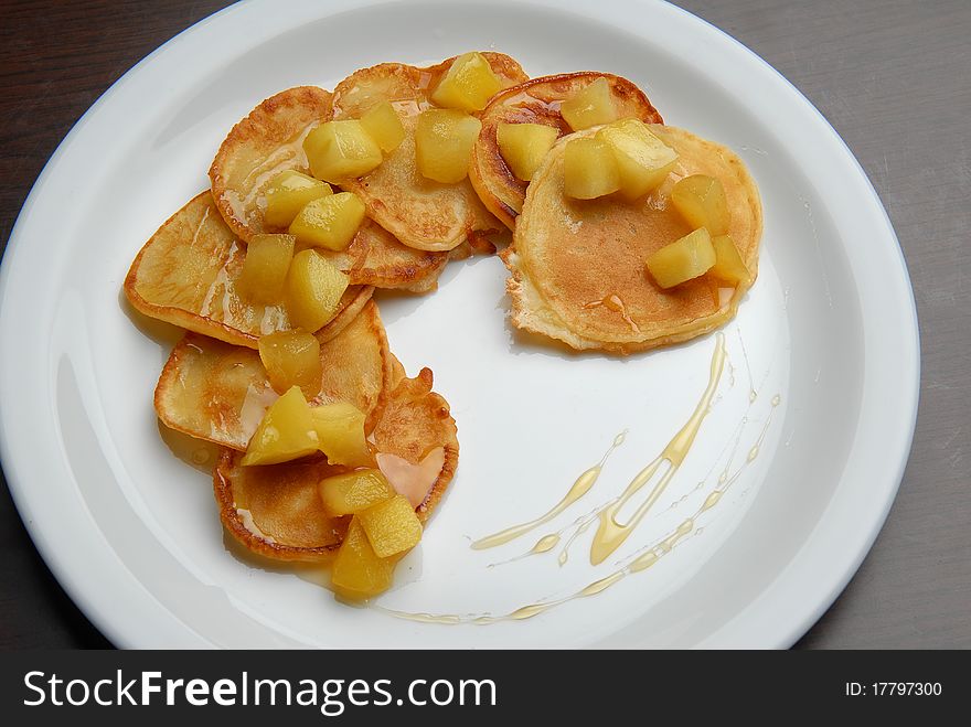 Pancakes with peach jam on a plate. Pancakes with peach jam on a plate