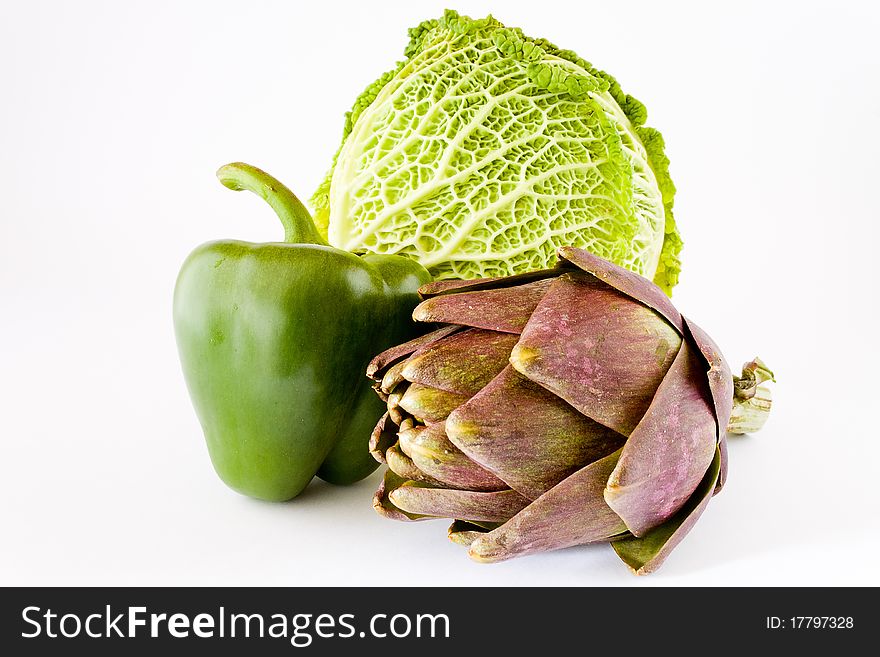 Closeup of pepper cabbage and artichoke isolated white background