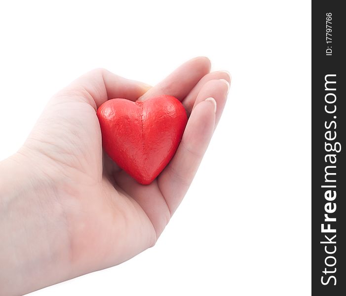 Red heart in my hand on a white background