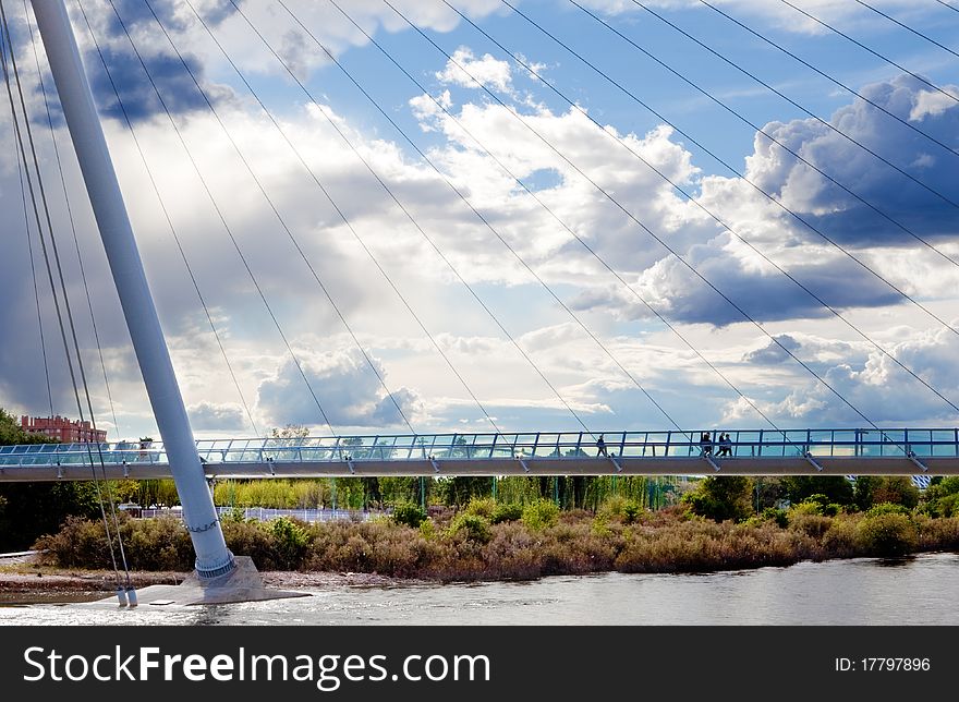 Cityscape with modern bridge and people